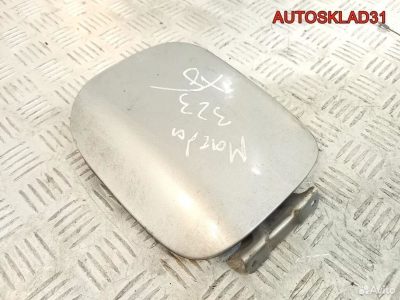 Лючок бензобака Mazda 323 BA B22H42410A Хетчбэк - АвтоСклад31.рф - авторазборка контрактные б/у запчасти в г. Белгород